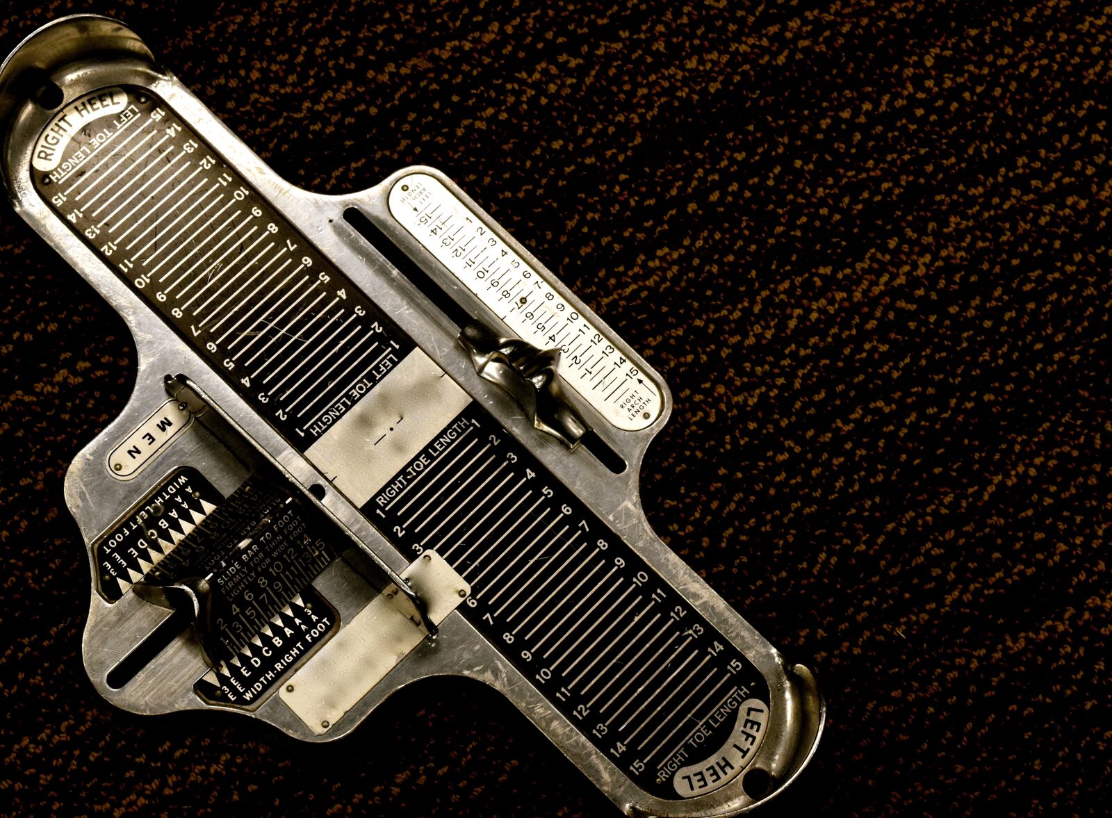 A vintage Brannock-style foot sizing device