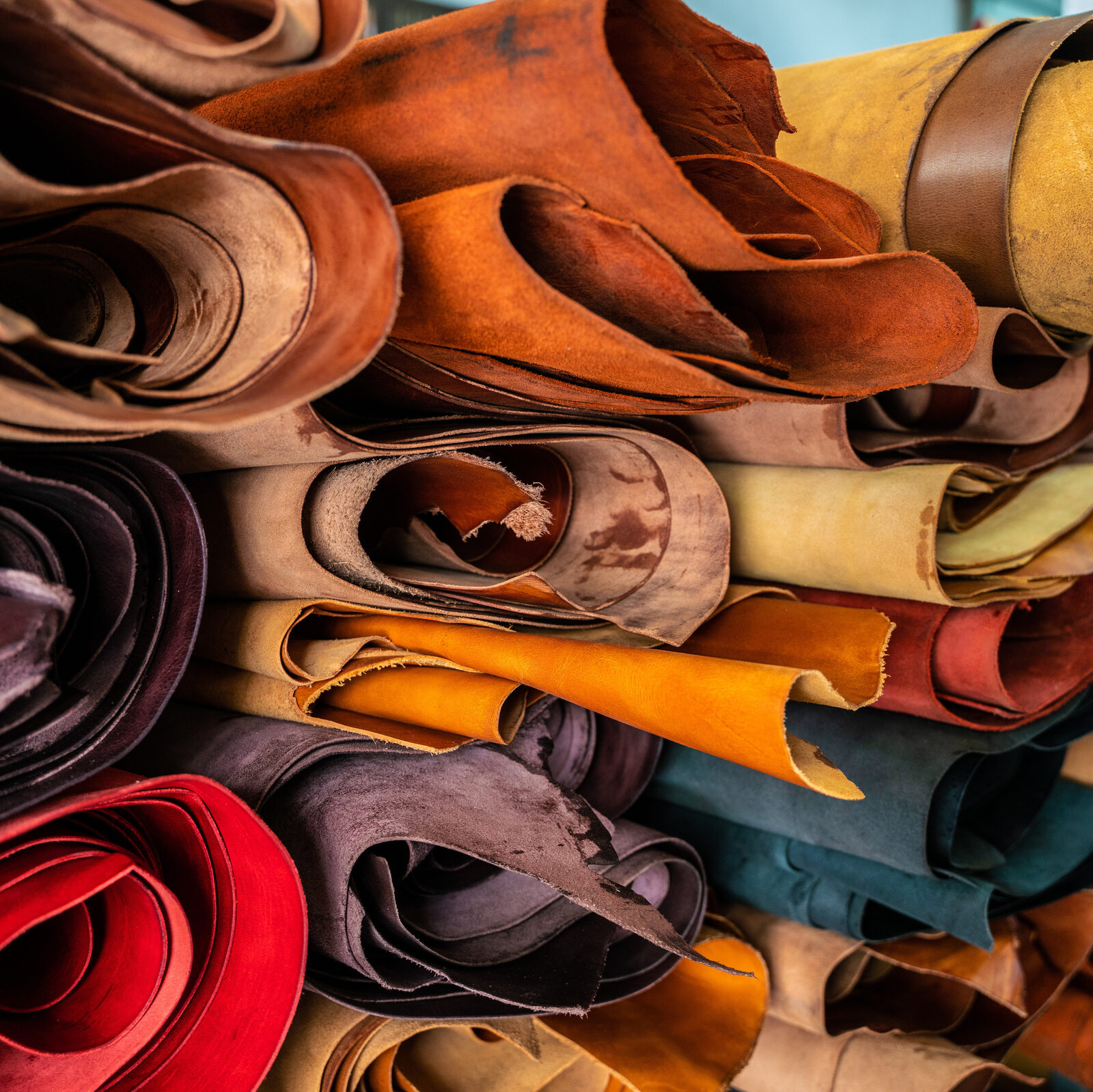 Rolled and stacked leather hides
